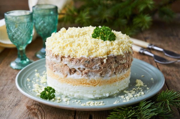 Layered salad "mimosa" with salmon, cheese and eggs