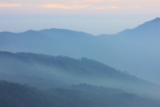 Layers of mountain covered with mist.