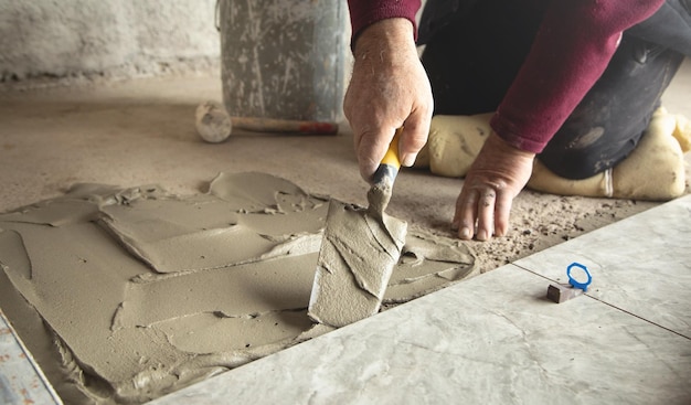 laying floor ceramic tile renovating the floor