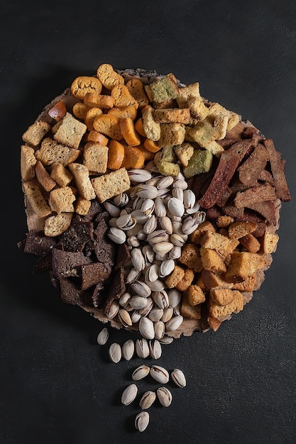 laying out of beer snacks salted fried croutons and pistachios