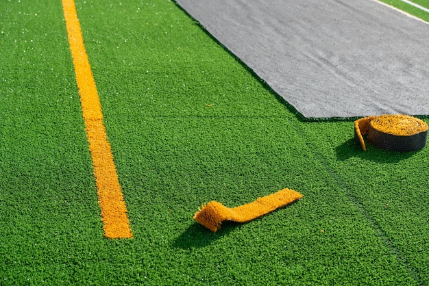 Laying of synthetic grass