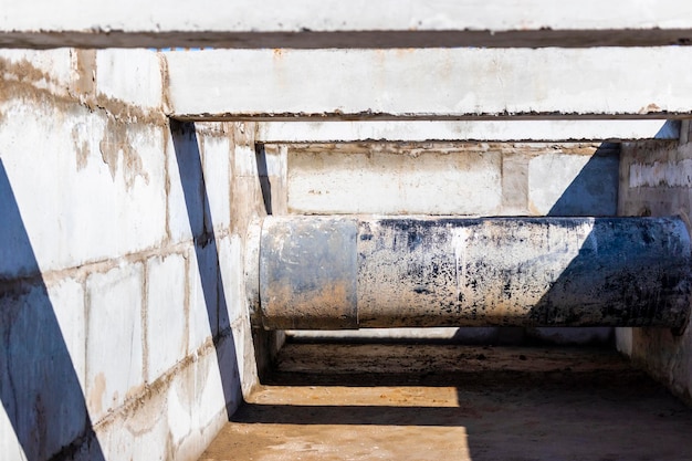 Laying of underground pipes in concrete chamber Installation of water main at the construction site Construction of stormwater pits sewerage valve sanitary system and pump station