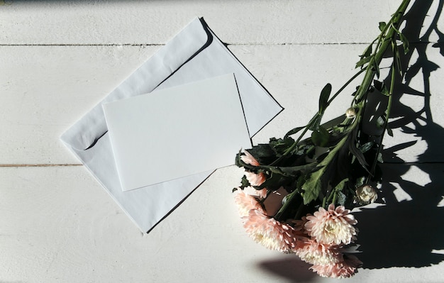 layout of an empty postcard and flowers