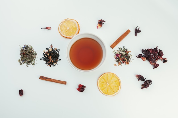 layout made of cup of black tea and leaves. Top view