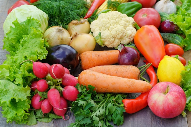 Layout made with of various vegetables and fruits on a table in a garden outdoor