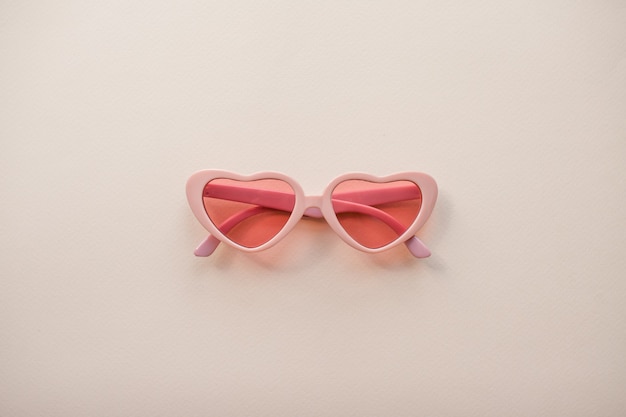 Layout pink glasses in the form of hearts