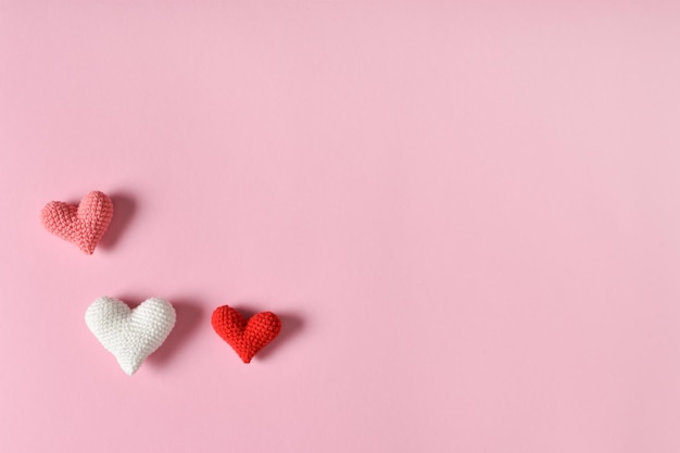 The layout of a Valentine's Day greeting card with hearts on a pink background