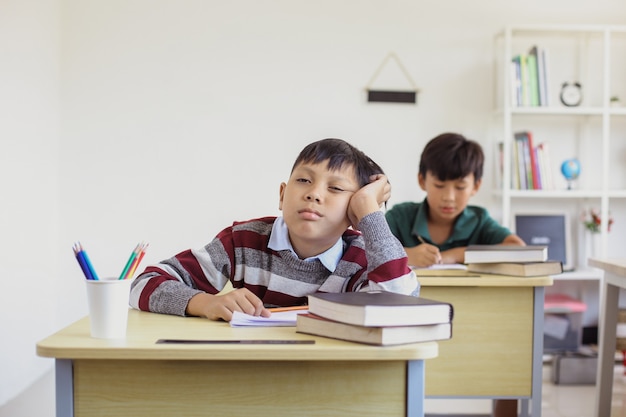 Lazy student during a lesson in a classroom