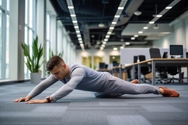 lazy young office employee stretching at workplace