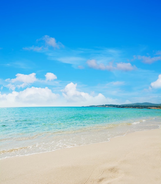 Le Bombarde beach under a blue sky with clouds Shot in Sardinia Italy