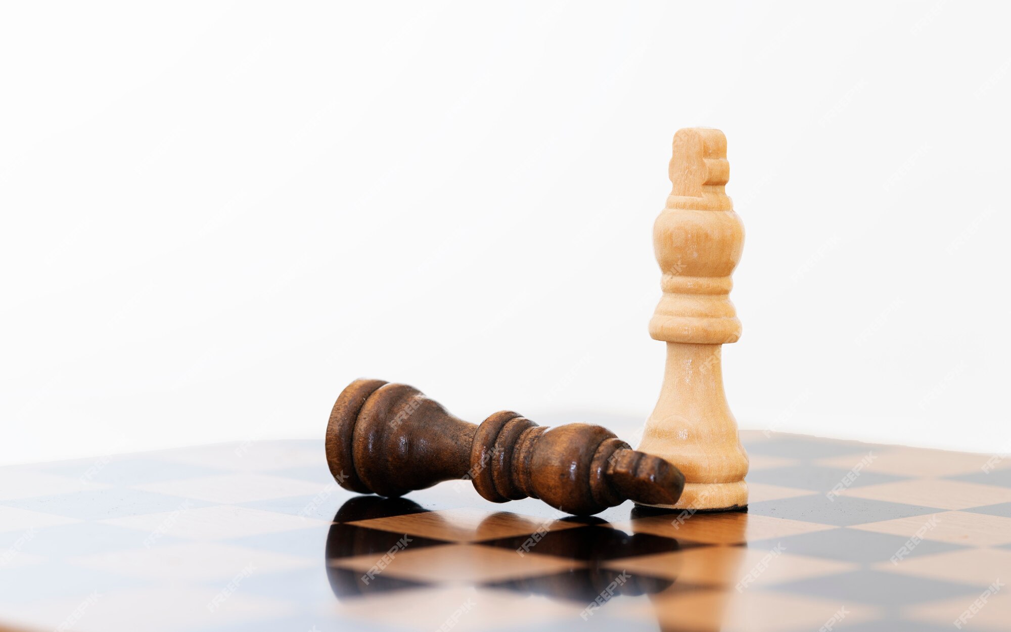 White Chess King Among Lying Down Black Pawns On Chessboard High-Res Stock  Photo - Getty Images