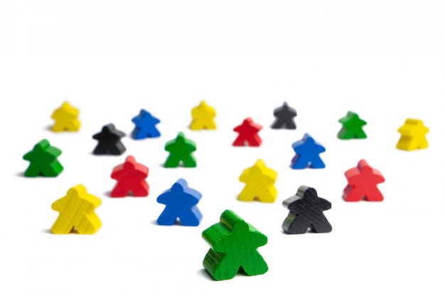 Photo leadership in a group of people with olorful game figures