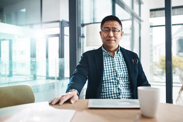 Leadership mature and asian man in portrait with investment wealth and business planning at his office Management ceo executive or corporate senior manager person or people with company vision