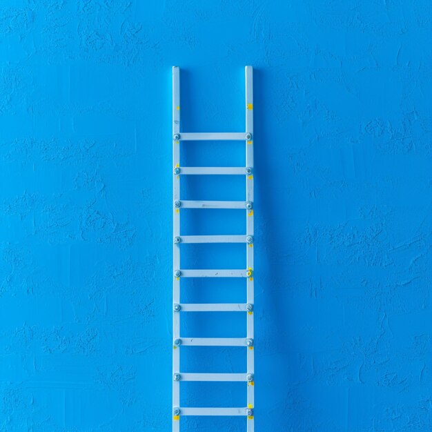 Photo leadership success concept ladder achievement on blue wall background for social media post size