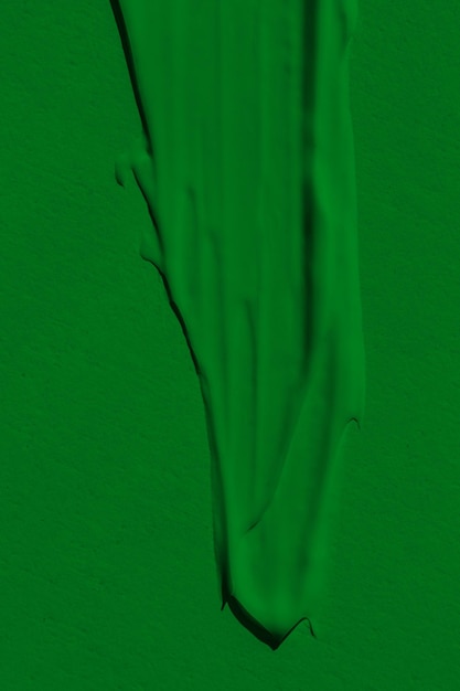 The leaky texture of the green paint Smudged paint is a liquid green color Background green color lunge spreading in the light Applied to the surface grassy natural