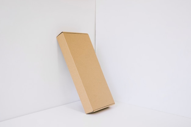 Leaning cardboard package