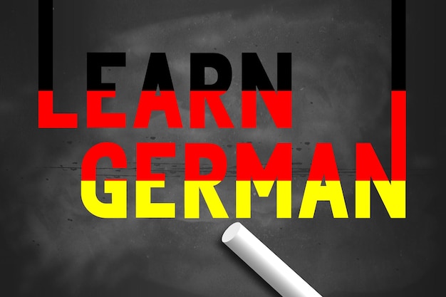 Photo learn german with germany flag color on chalkboard