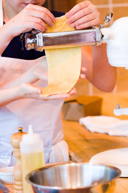 Learning how to make fresh spaghetti from scratch.