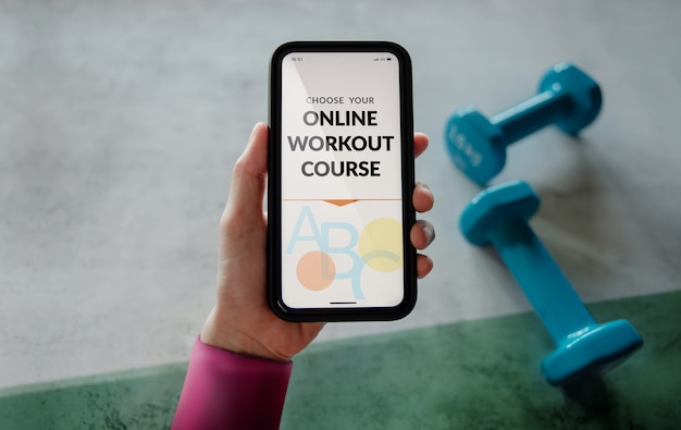 Learning Online Workout Concept. Young Woman using Mobile phone to choosing an Exercising Course.