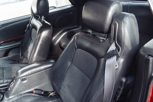 Photo leather black interior of a luxury car handmade leather upholstery