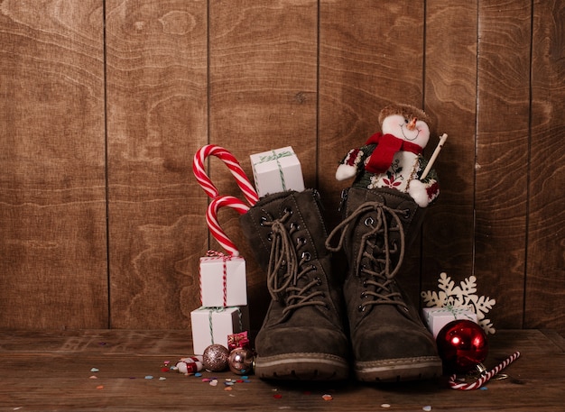 Leather boots with christmas treats and presents.