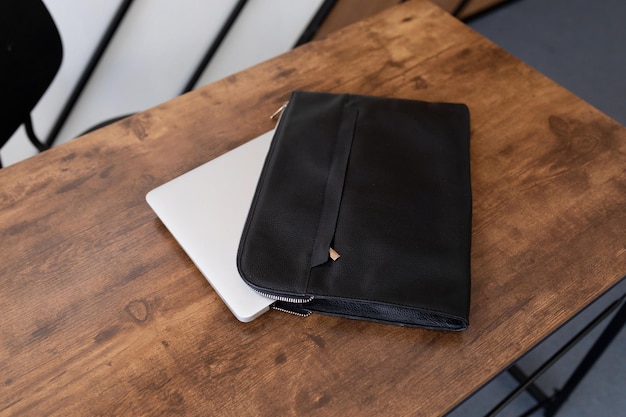 Leather folder laptop case on the table