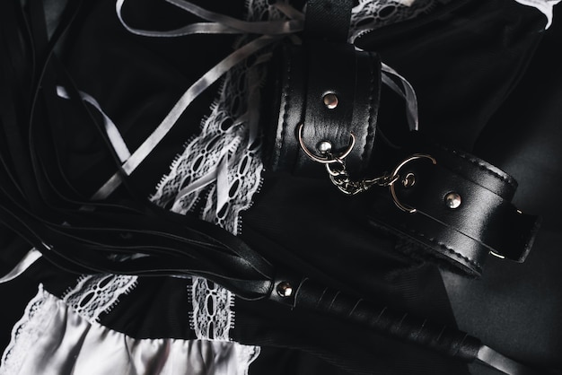 Leather handcuffs and whip for bdsm sex