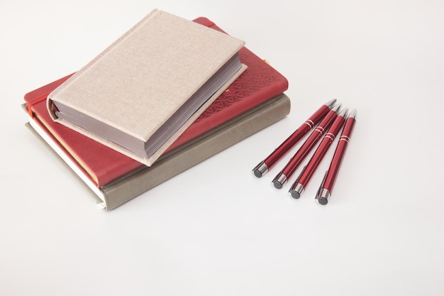 Photo leather notebook and pen isolated on the white