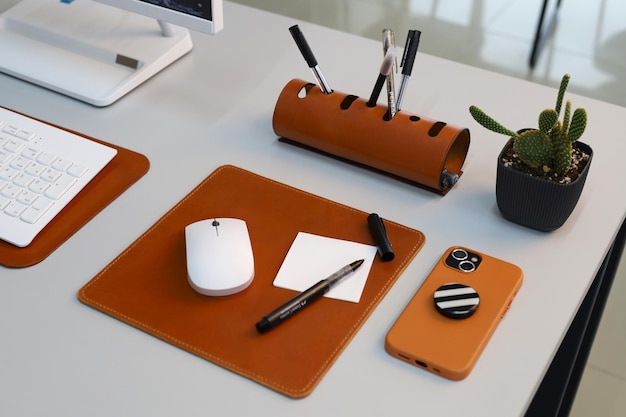 Photo leather office accessories isolated on office desk