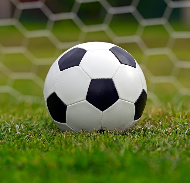 Leather soccer ball on a football stadium