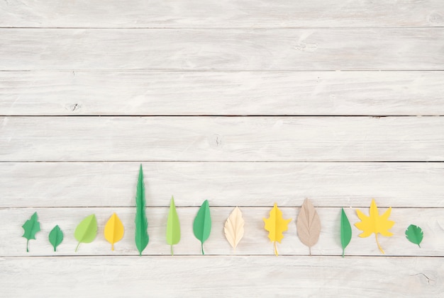 The leaves are made of colored paper. paper cut trendy craft style. Modern design for adve