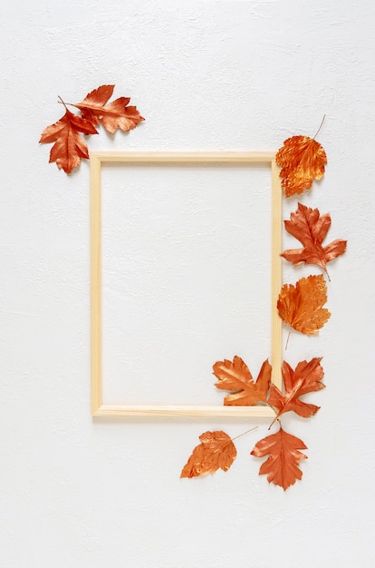 Leaves stained with gold paint on white