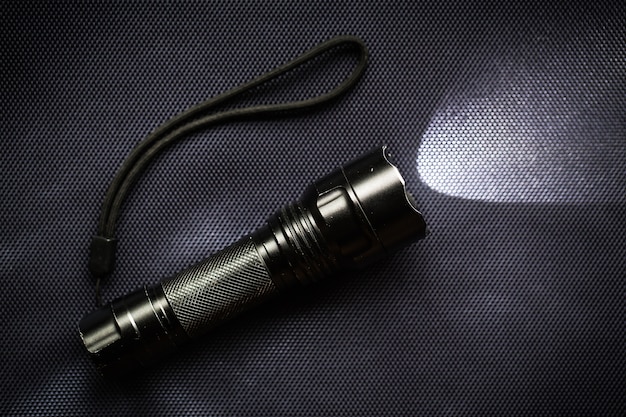 LED flashlight with a light beam for hiking at night.