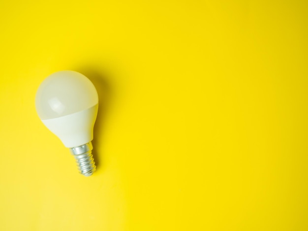 Photo led light bulbs on yellow background energy saving and environmentally friendly light bulbs