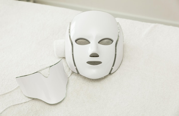 Photo led mask for facial rejuvenation glows in different colors