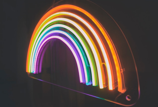 Photo the led neon rainbow shines in the dark room