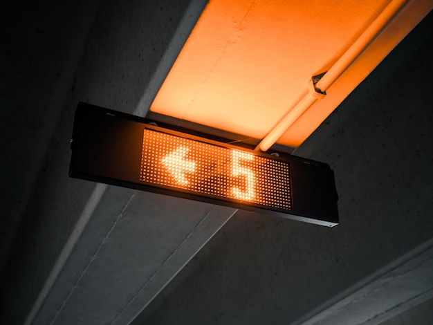 led sign in a dark secure covered parking display places street mood ambiance artistic