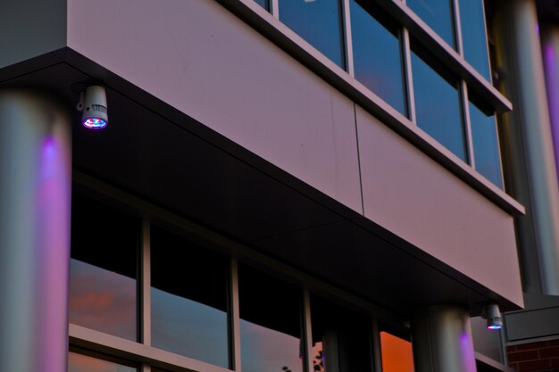 Photo led spotlight illuminating modern building facade at twilight in fort wayne