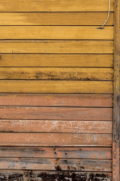 Foto leeftijd rustieke houten achtergrondstructuur in geel.