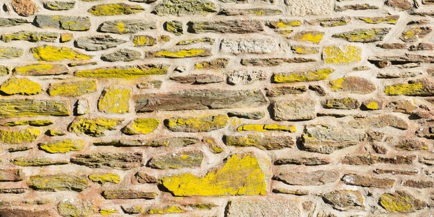 Leeftijd verweerde stenen muur achtergrond