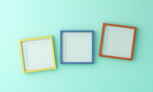 Leeg geel blauw en oranje fotolijst voor invoegen tekst of afbeelding binnen op groene kleur muur.