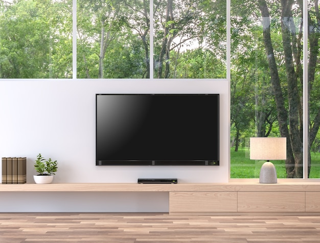 Leeg televisiescherm met uitzicht op de natuur 3d render. Er zijn houten vloer, houten plank en witte muur. Er is een uitknippad naar het tv-scherm.