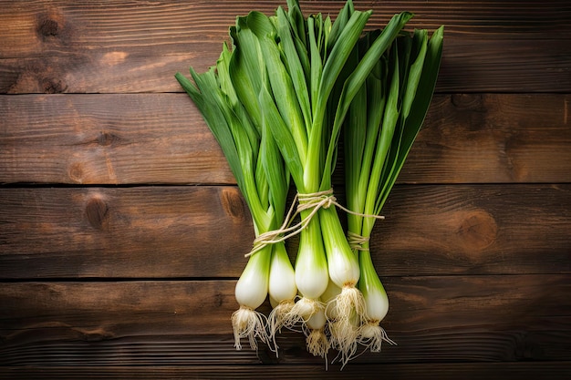 Leeks placed on wooden table in flat lay arrangement