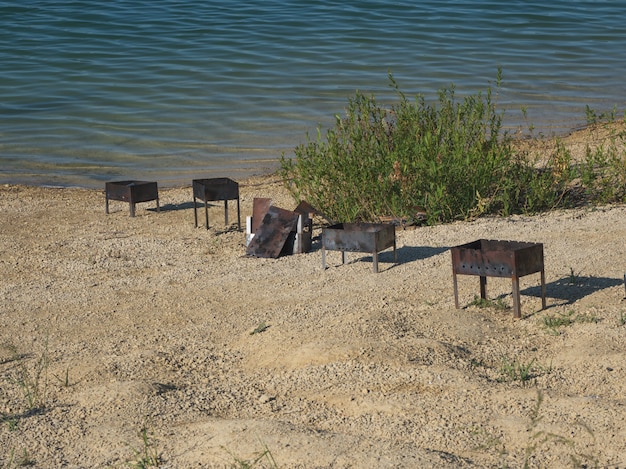 Left garbage on the shore of the lake