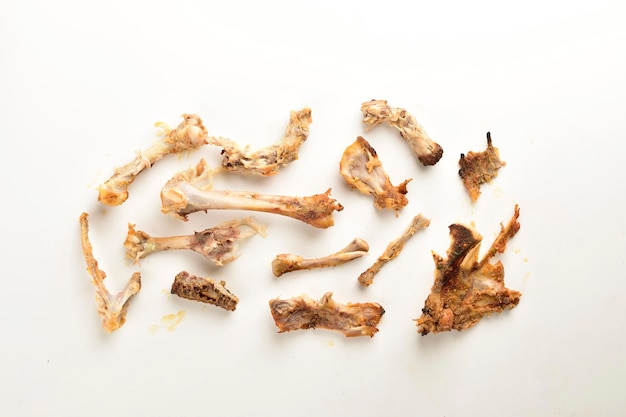 Leftover chicken bones isolated on white background