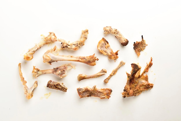 Leftover chicken bones isolated on white background