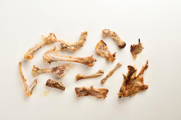 Leftover chicken bones isolated on white background