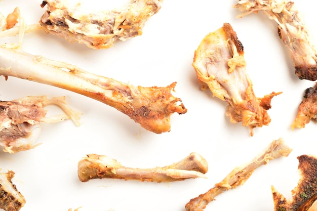 Leftover chicken bones isolated on white background