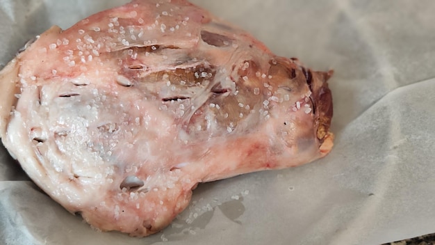 Leg of lamb prepared to be cooked in Turkish style lamb tandoori making photo