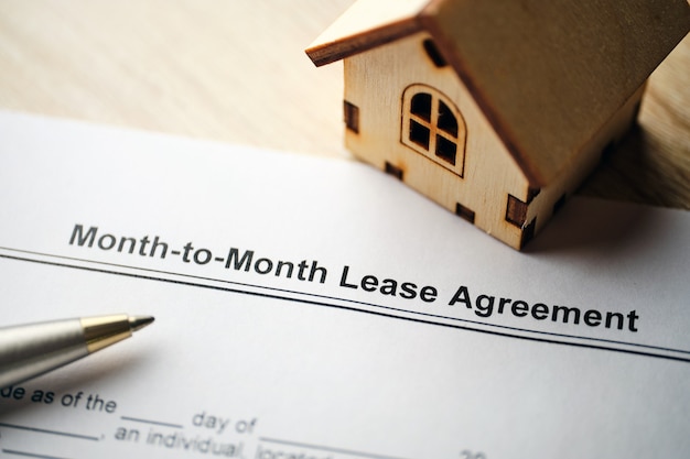 Photo legal document month-to-month lease agreement on paper.